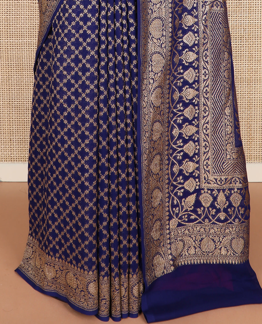 Blue jaal jacquard banarasi silk saree, floral creeper zari border, and pallu of Mughal-style intricate designs