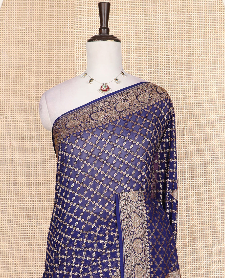Blue jaal jacquard banarasi silk saree, floral creeper zari border, and pallu of Mughal-style intricate designs