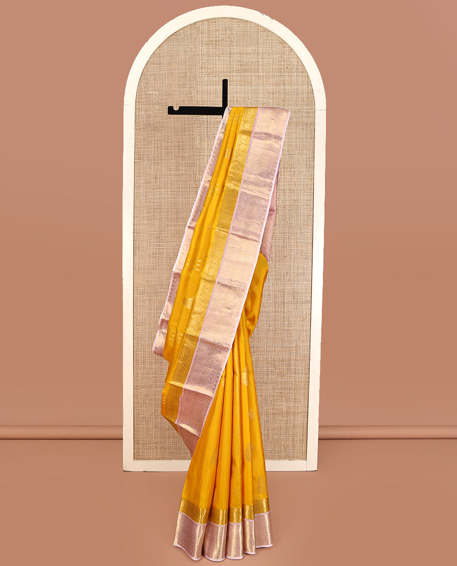 Mustard Yellow-Beach Pink Vasundhara Silk Saree, Richly Detailed with Zari Buttas, Complemented by Contrast Border of Kamalam, Muthu, Cross Kamalam, Rudraksham, and Thilakam Design, Pallu Steeped with Thilakam Designs, and Paired with a Contrast Blouse