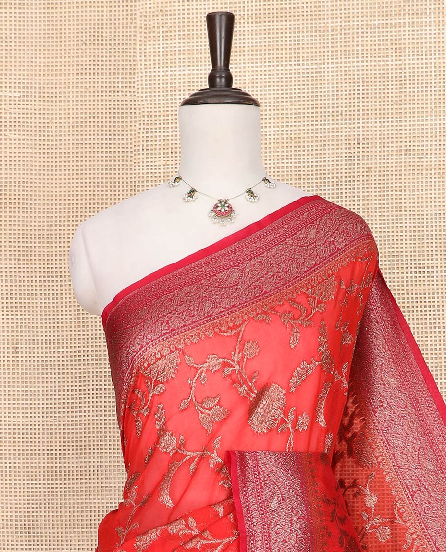 Red Fancy Georgette Saree Gracefully Embellished with Floral Jaal Jacquard Design, Highlighted by Zari Border of Paisleys, Zari Woven Pallu Featuring Floral Designs in Zari, and Paired with a Matching Blouse