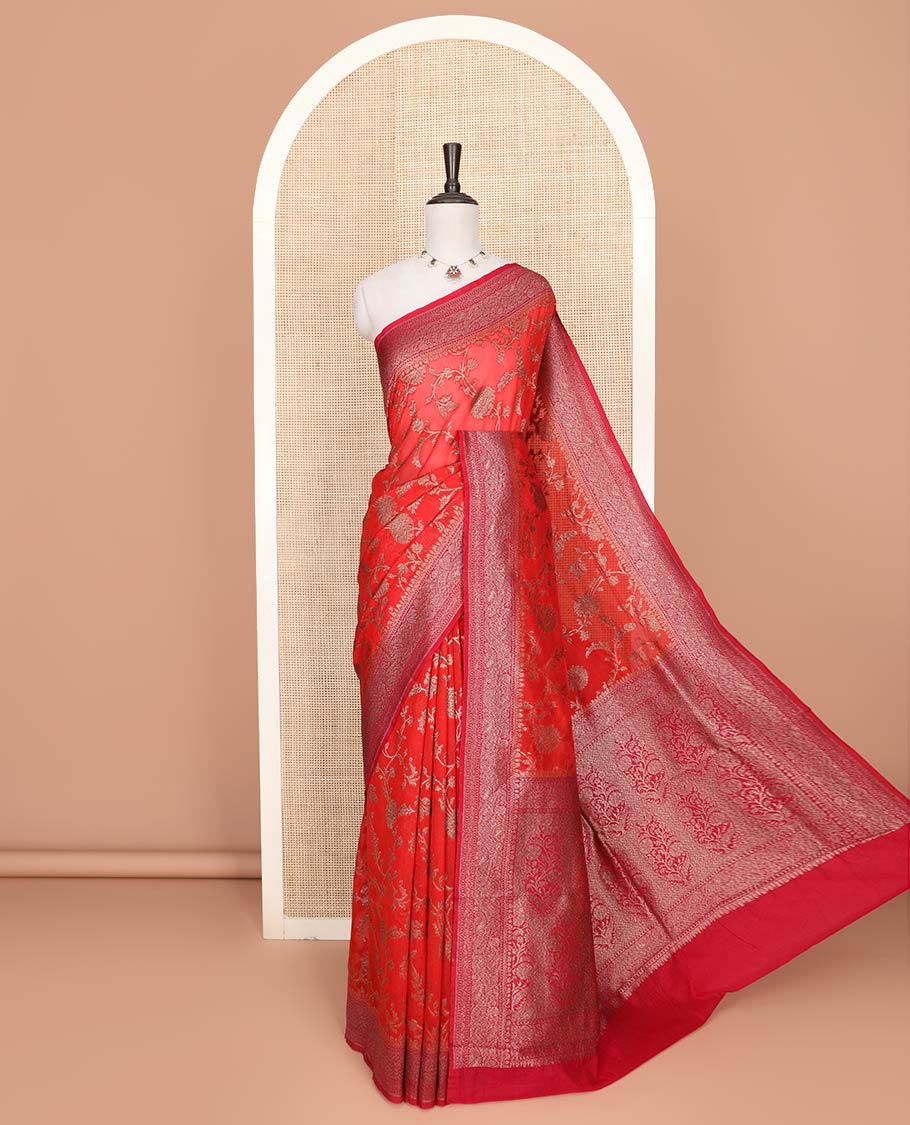Red Fancy Georgette Saree Gracefully Embellished with Floral Jaal Jacquard Design, Highlighted by Zari Border of Paisleys, Zari Woven Pallu Featuring Floral Designs in Zari, and Paired with a Matching Blouse