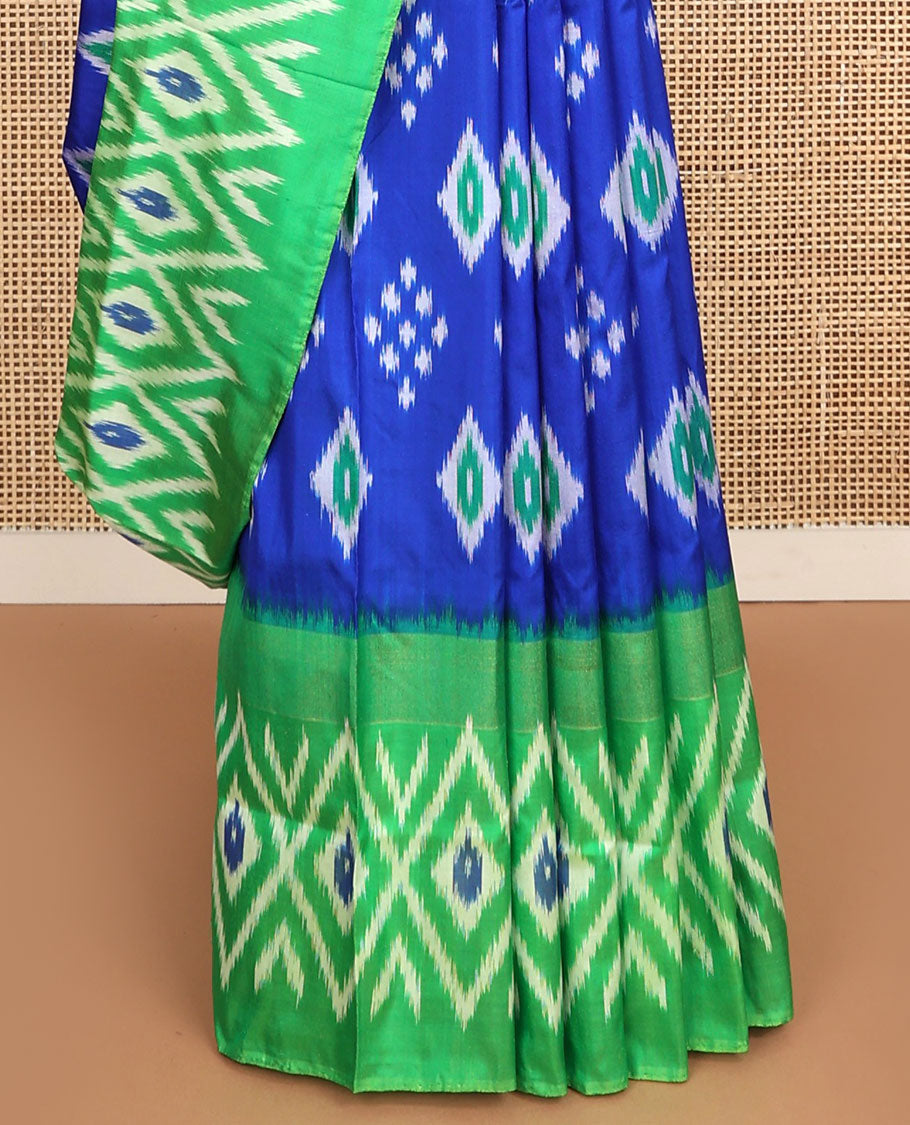 Blue floral design ikkat saree with contrast geometric design border & argyle design pallu