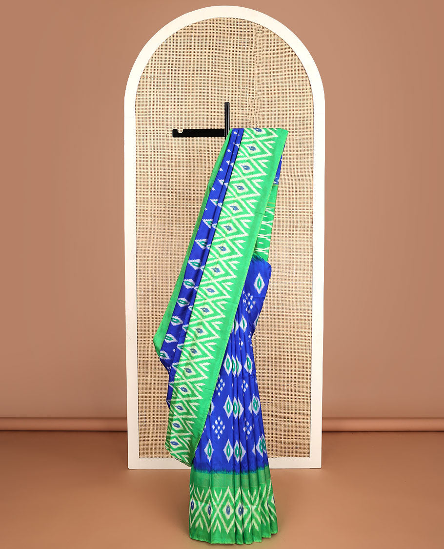 Blue floral design ikkat saree with contrast geometric design border & argyle design pallu