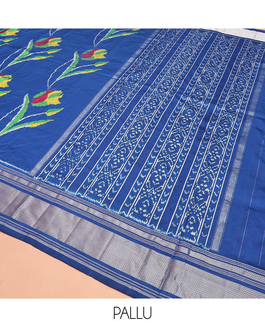 Blue Ikkat Silk Saree Colourfully Woven in Floral Buttas Across the Body, Featuring a Zari Border, a Pallu Adorned with Ikkat Weave, and Paired with a Matching Blouse