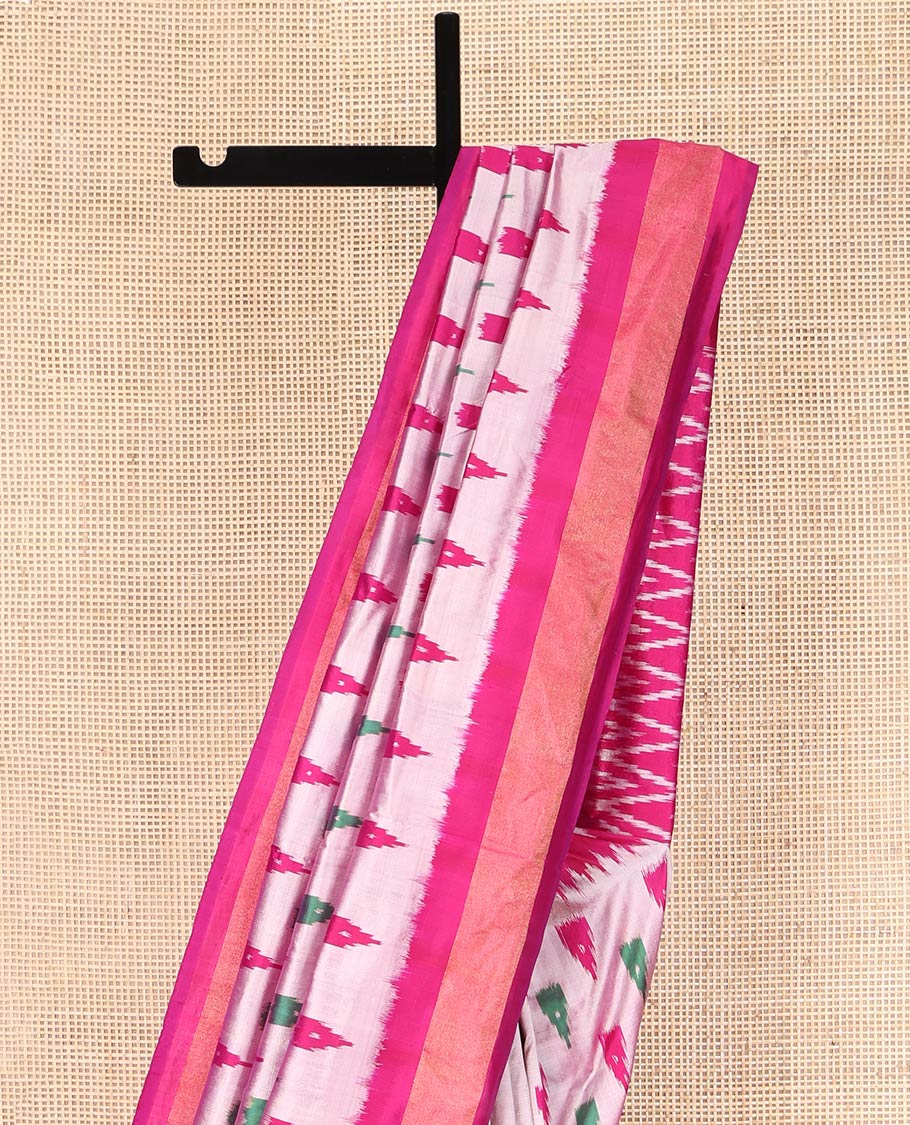 Grey Ikkat Silk Saree, Adorned with Temple Buttas All Over Its Body, Complemented by a Contrast Temple Border, Pallu of Butta Enclosed Jaal Designs, and Paired with a Contrast Blouse
