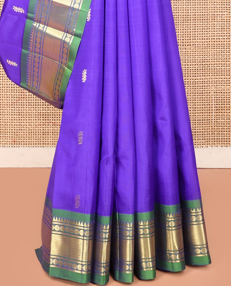 Violet Kanchipuram Silk Saree, Adorned with Zari Buttas, a Contrast One-Sided Border of Rekku, Rudraksham, and Vanki, a Zari-Design Pallu, and No Blouse