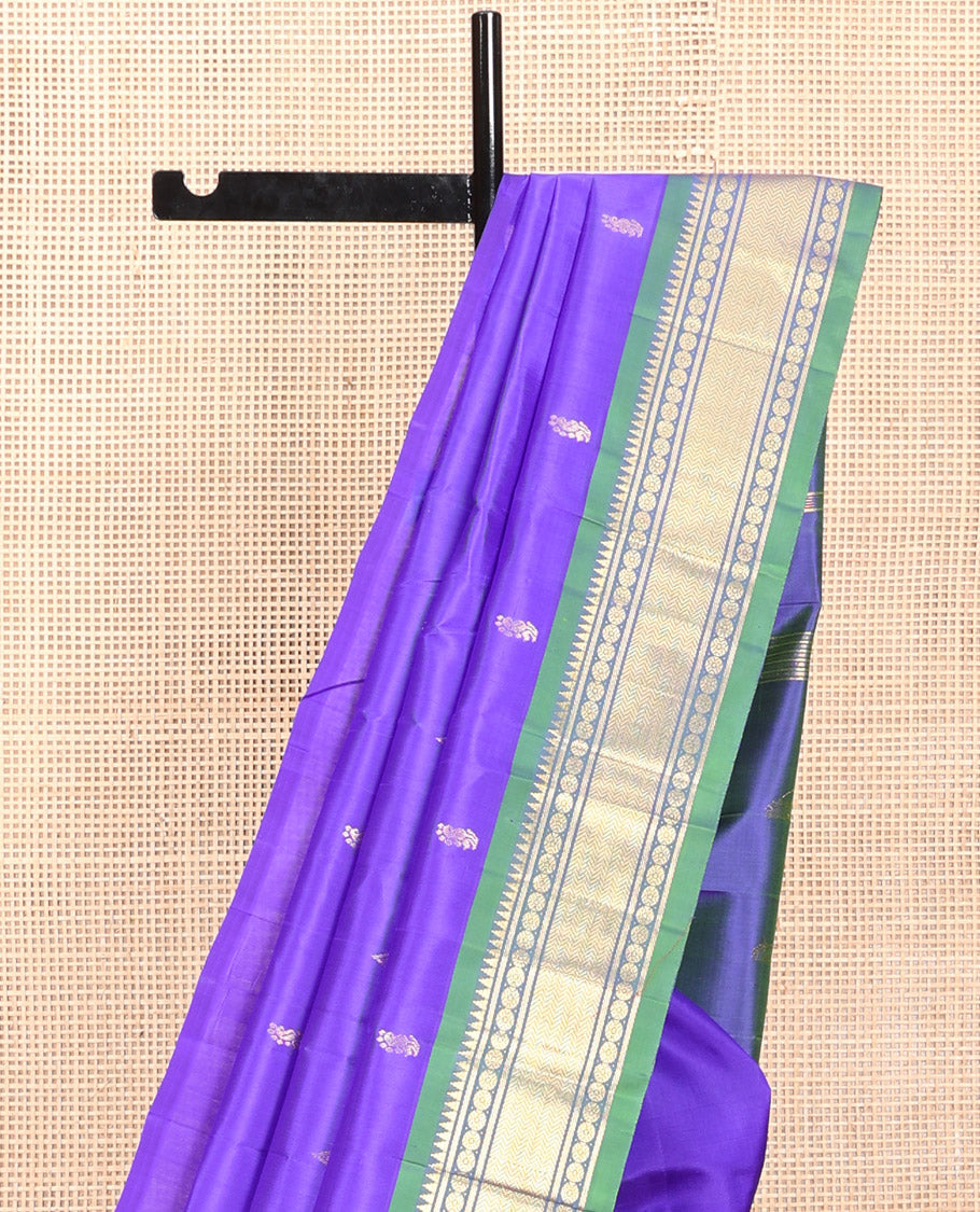 Violet Kanchipuram Silk Saree, Adorned with Zari Buttas, a Contrast One-Sided Border of Rekku, Rudraksham, and Vanki, a Zari-Design Pallu, and No Blouse