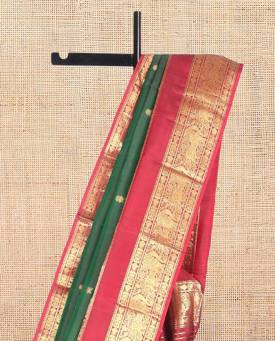 Green Kanchipuram Silk Saree, Adorned with Zari Buttas, Complemented by a Contrast Rettai Pettu Border of Rekku, Meen, and Yaali, Grand Jaal Pallu, and Contrast Blouse