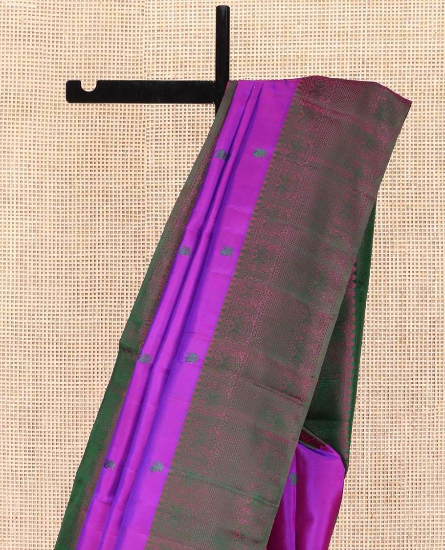 Purple Kanchipuram Silk Saree, Adorned with Diamond and Mayil Thread Buttas on Its Body, Complemented by a Contrast Border of Thilakam Mokku, Iruthalai Pakshi, and Kuyil Kann Designs, Pallu of Jaal Designs, and Paired with a Contrast Blouse