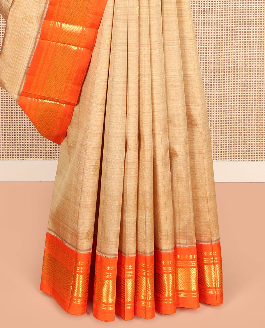 Sandal Kanchipuram Silk Saree, Graced with Zari Buttas on Its Body, Complemented by a Contrast One-Sided Korvai Border of Panner Sombu, Banaras, Muthu, and Mayil Kann Designs, Pallu Steeped with Zari Designs, and Comes Without a Blouse