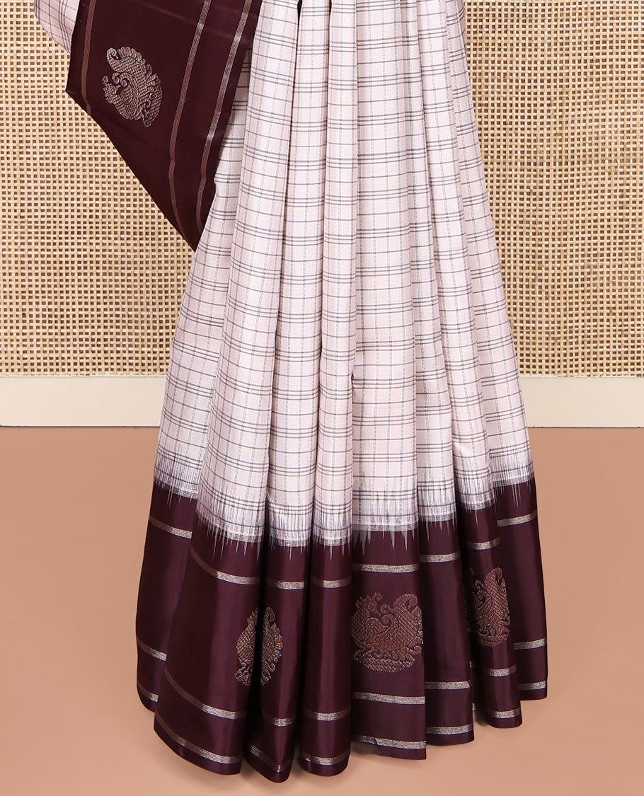 Off-white Kanchipuram Silk Saree, Subtly Sparkled with Checked Design On Its Body, Complemented by Contrast Border of Banaras and Annam Designs, Pallu of Diagonal Rekku Designs, and Paired with a Contrast Blouse