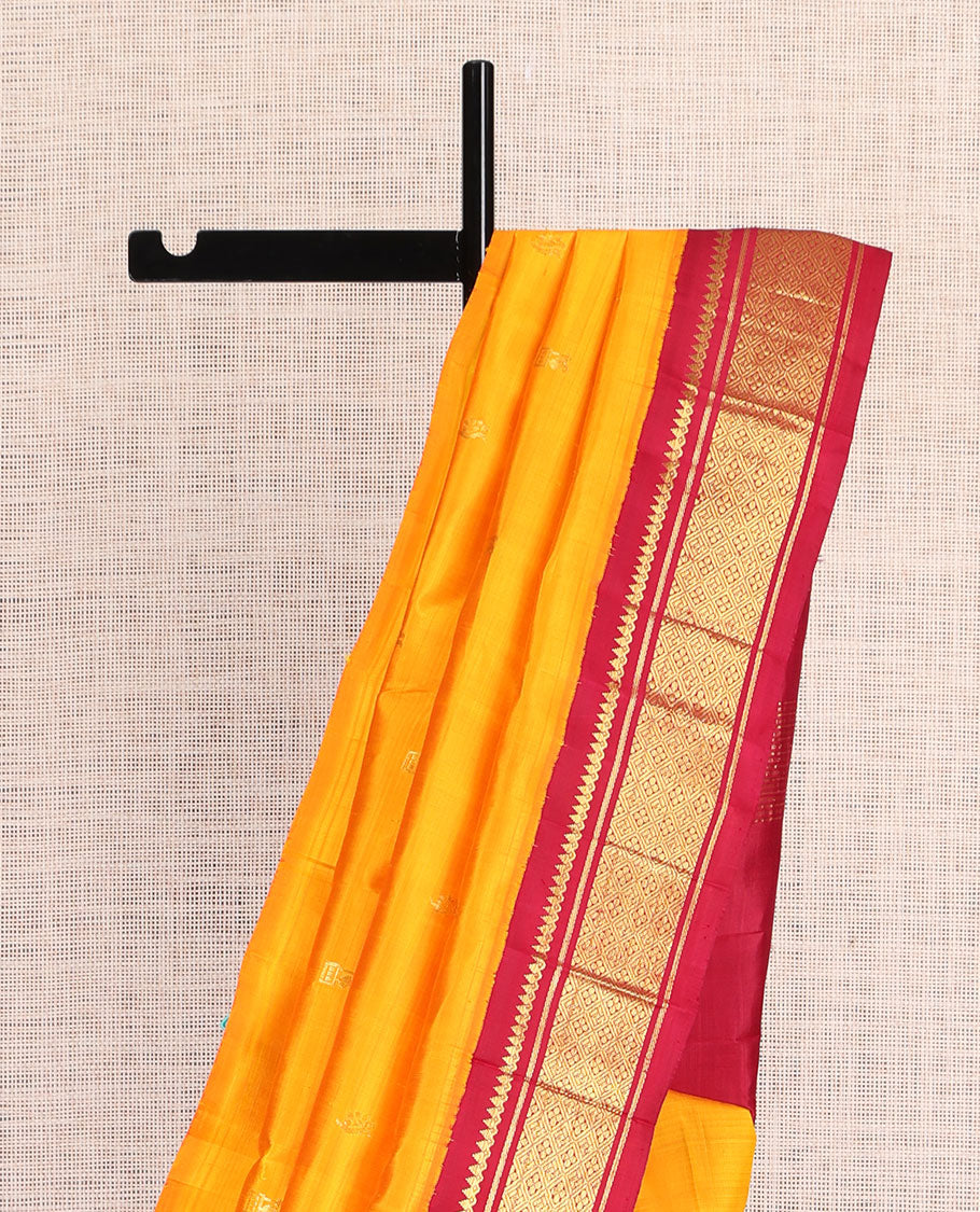 Orange Kanchipuram Silk Saree, Adorned with Zari Buttas, a Contrast Korvai One-Sided Border of Thilakam Mokku, Banaras, and Jaal Designs, Zari Design Pallu, and No Blouse