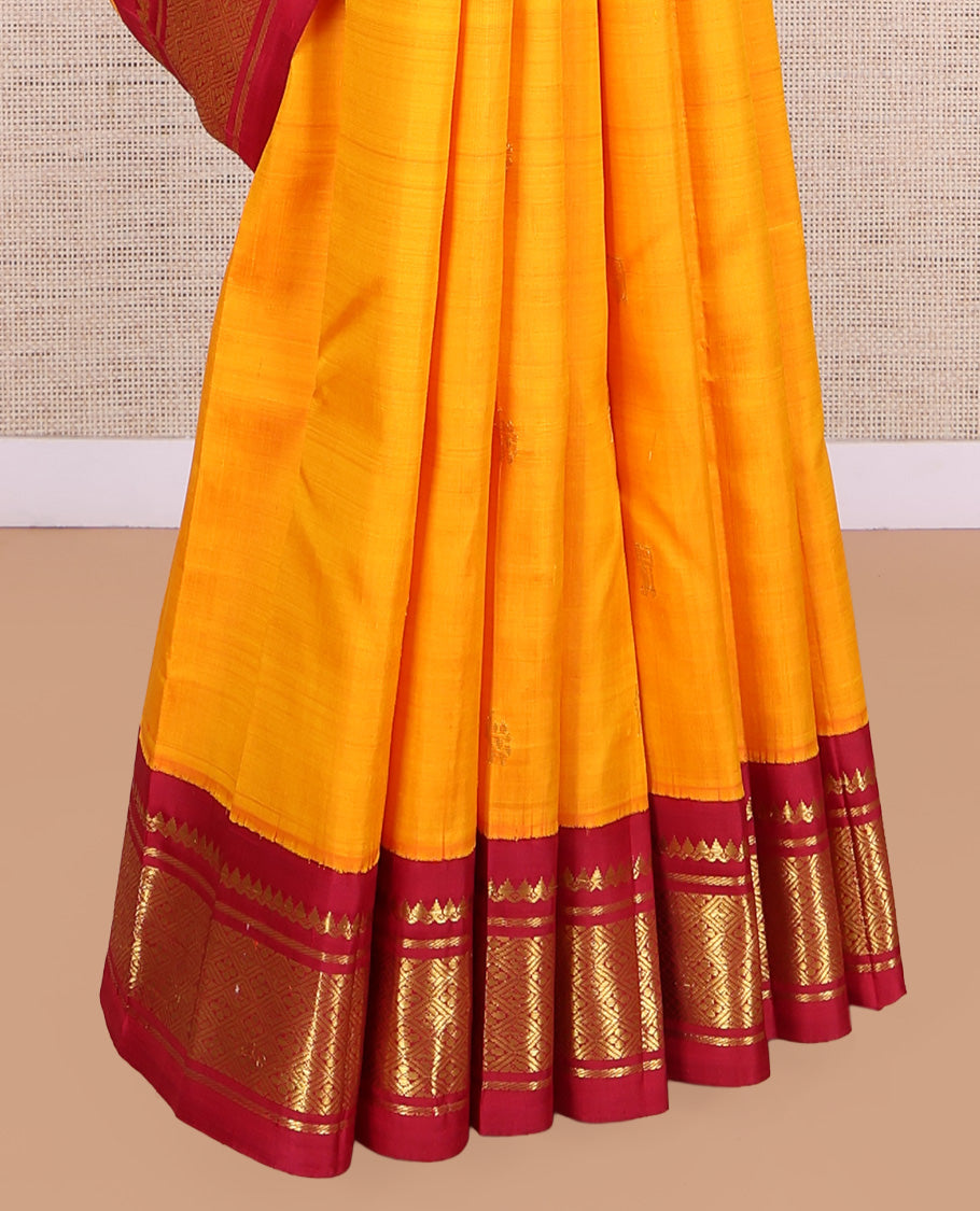 Orange Kanchipuram Silk Saree, Adorned with Zari Buttas, a Contrast Korvai One-Sided Border of Thilakam Mokku, Banaras, and Jaal Designs, Zari Design Pallu, and No Blouse