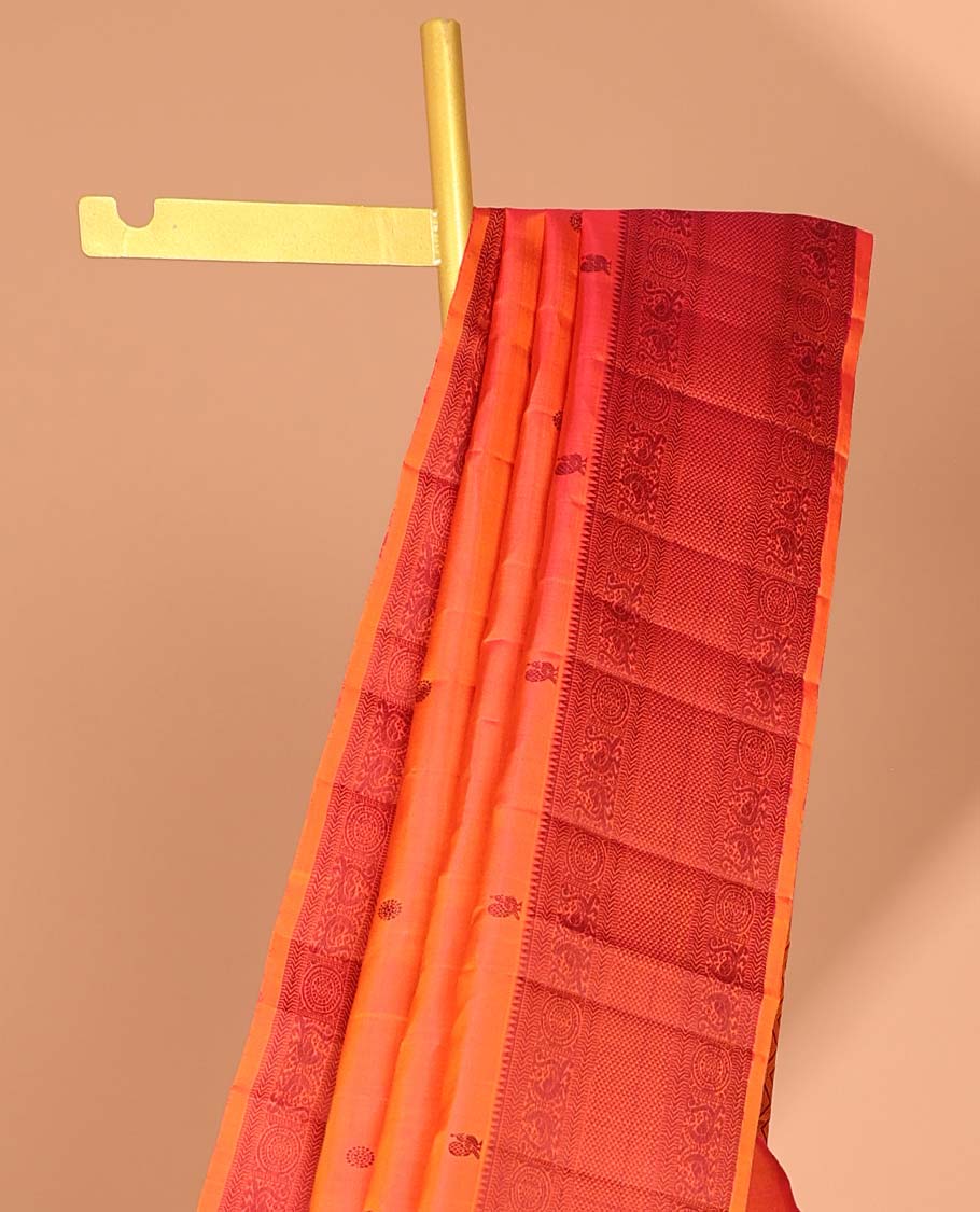 Orange buttas kancheepuram silk saree with contrast border of rekku, kathir,poo chakram, mayil, ara maadam design & zari design pallu