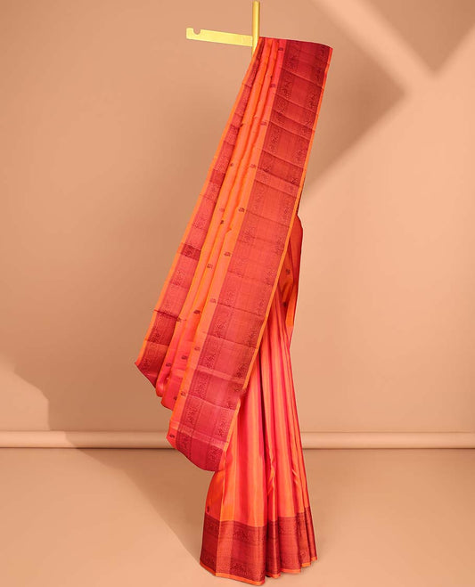 Orange buttas kancheepuram silk saree with contrast border of rekku, kathir,poo chakram, mayil, ara maadam design & zari design pallu