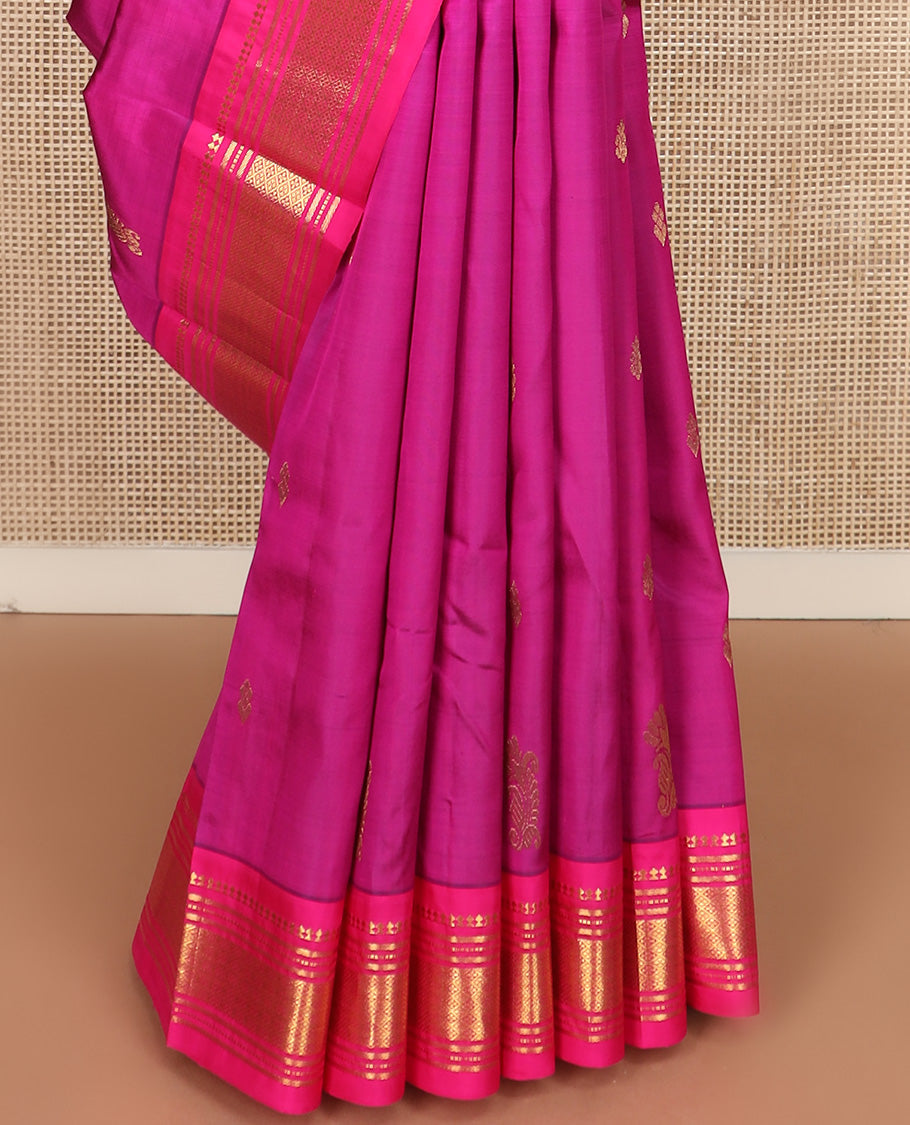 Pink zari buttas Kanchipuram silk saree, contrast one-sided border of paneer sombu, banaras, muthu, and jaal design, and manga design pallu