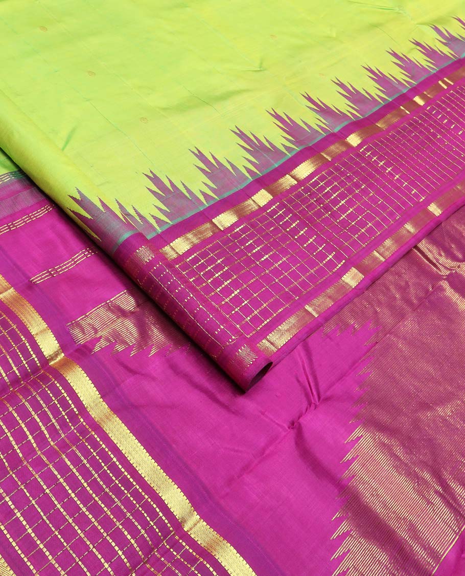 Green zari buttas Kanchipuram silk saree, contrast thazampoo rekku one-sided border of muthu, and muthu kattam designs, and pallu of pillaiyar mokku designs