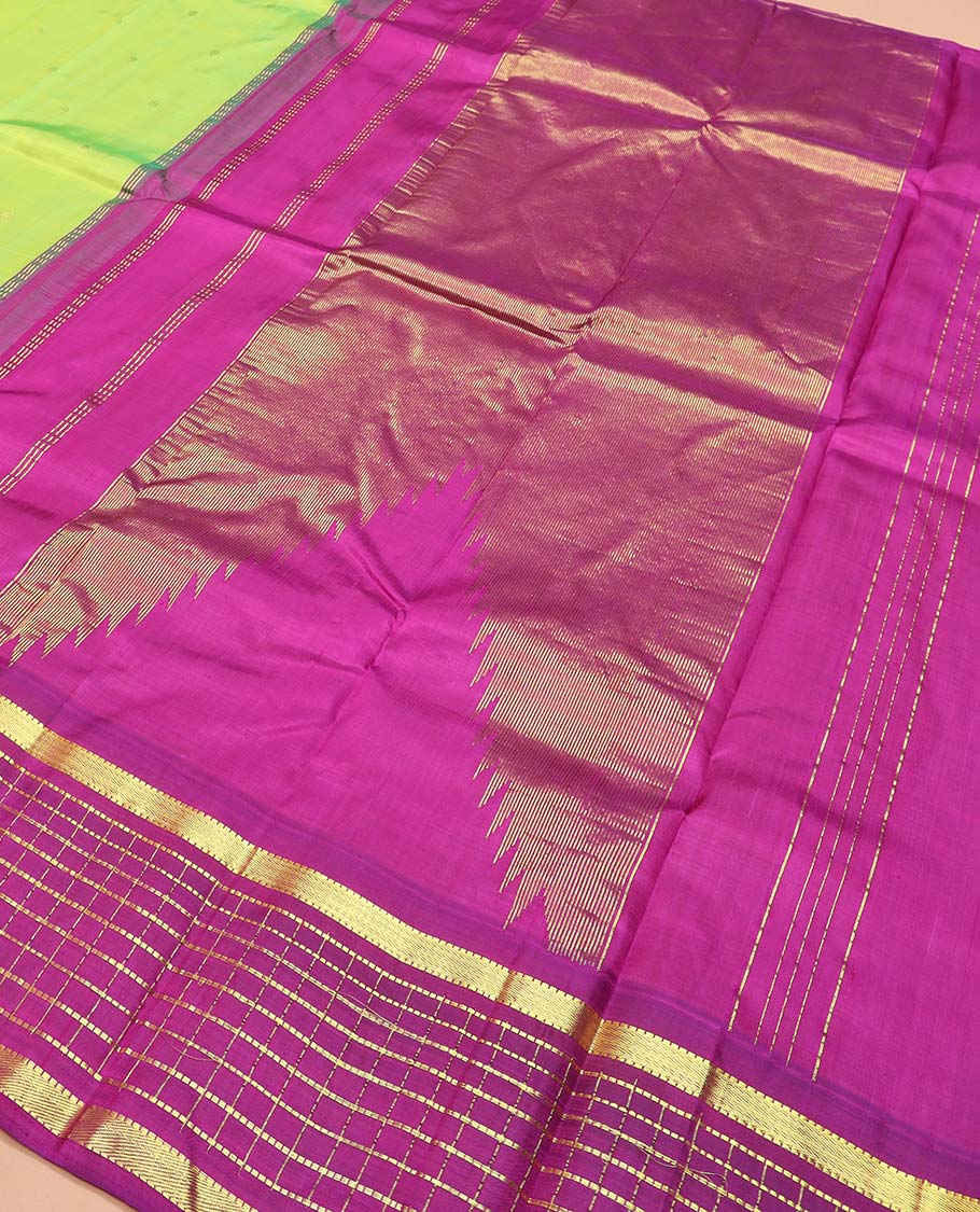 Green zari buttas Kanchipuram silk saree, contrast thazampoo rekku one-sided border of muthu, and muthu kattam designs, and pallu of pillaiyar mokku designs