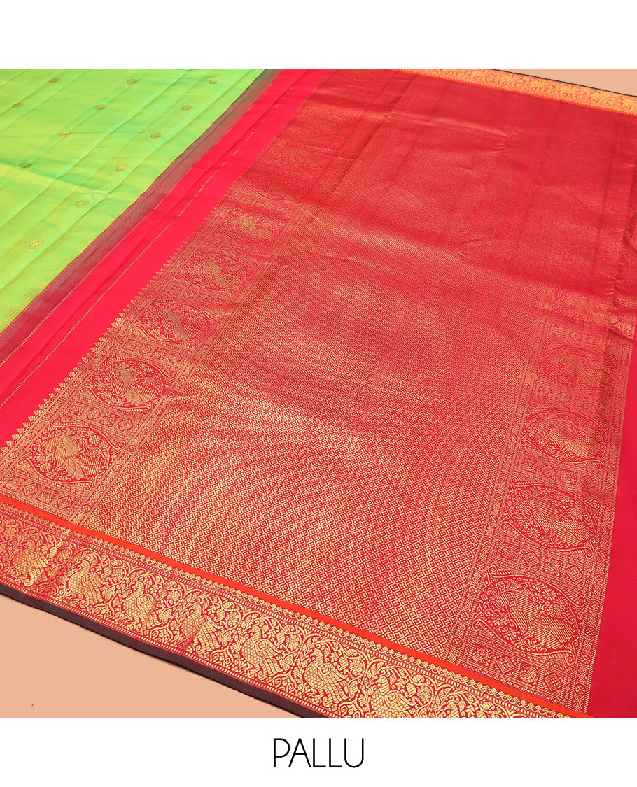 Green zari buttas Kanchipuram silk saree, contrast korvai border of thilakam mokku, muthu, and mayil designs, and jaal pallu