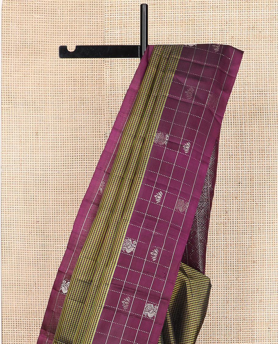Green stripes and muthu striped Kanchipuram silk saree, contrast border of mayil and lotus butta enclosed checks, and intricate jaal pallu