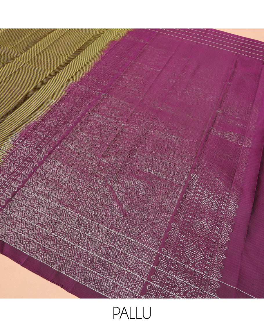 Green stripes and muthu striped Kanchipuram silk saree, contrast border of mayil and lotus butta enclosed checks, and intricate jaal pallu