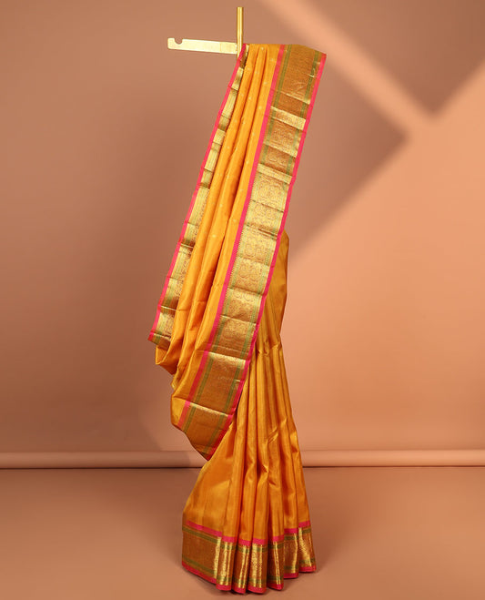 Orange leaf buttas kancheepuram silk saree with contrast border of sombu, paun, mayil design & zari design pallu