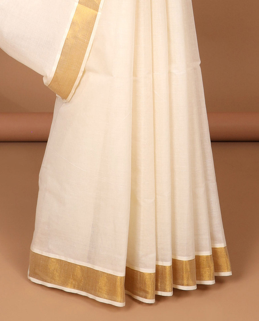 Cream kerala saree with zari stripes, zari border & pallu of floral designs