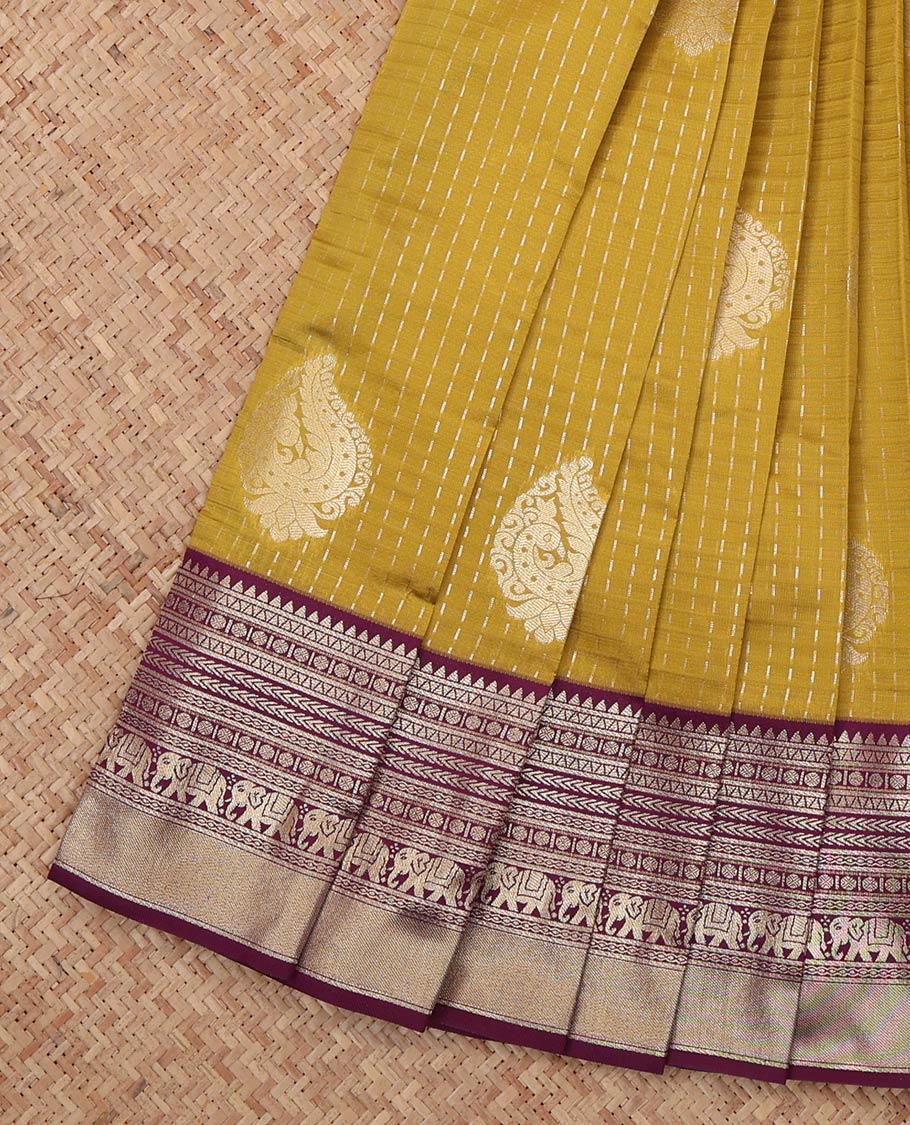 Mustard Litchi Saree, Gleamed Up with Zari Buttas and Checks, a Contrast Traditional Zari Border, Grand Pallu, and a Contrast Blouse