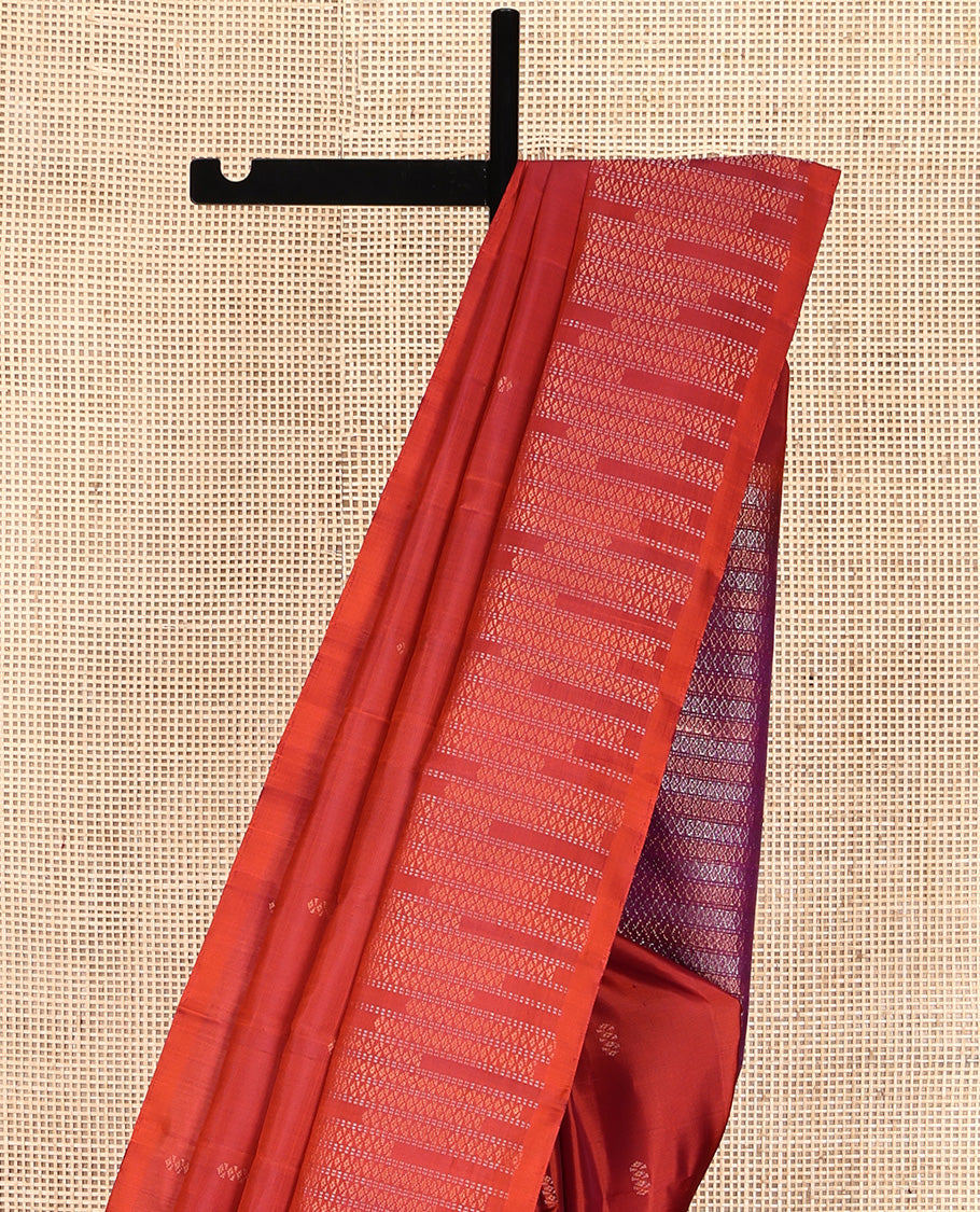 Rust Mayuri Soft Silk Saree, Subtly Eriched with Buttas All Over Its Body, Highlighted by Zari Geometric Patterned Border, Contrast Geometric Patterned Pallu, and Paired with a Contrast Blouse