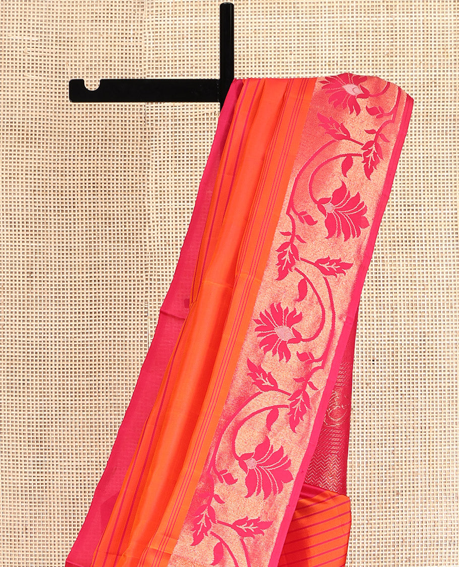 Orange Mayuri Soft Silk Saree, Subtly Sparkled with Stripes, Complemented by a Contrast Floral Creeper Border, a Pallu of Floral Designs, and a Contrast Blouse
