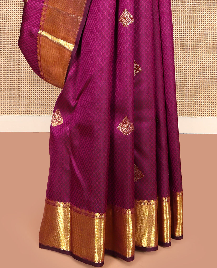 Wine Parampara Silk Saree, Enriched with Zari Buttas and Embossed Texture On Its Body, Highlighted by Zari Border of Thazampoo Rekku, Muthu, and Vanki Designs, Pallu Features Vanki Designs and Paired with a Matching Blouse