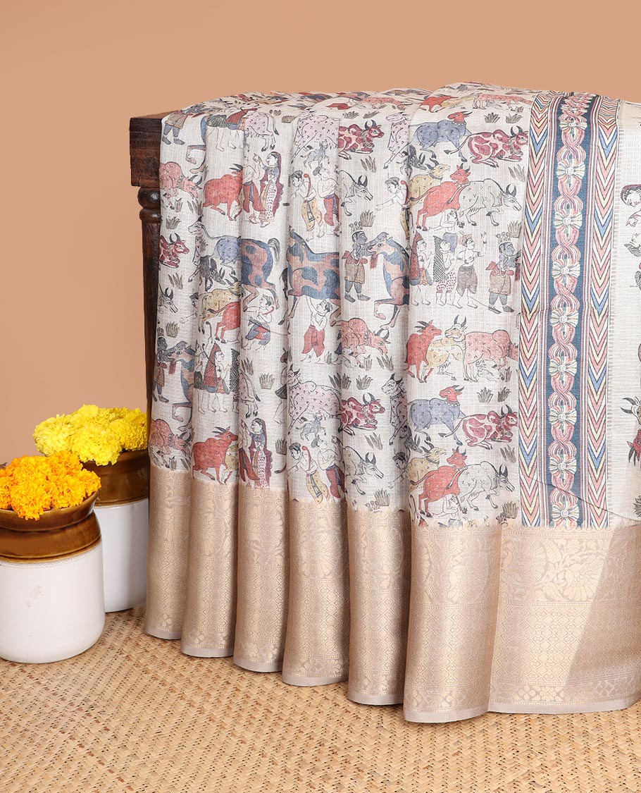 Cream all-over animal, fifure motif digtal printed with contrast gold zari jacquard border & printed rich pallu along with contrast plain blouse