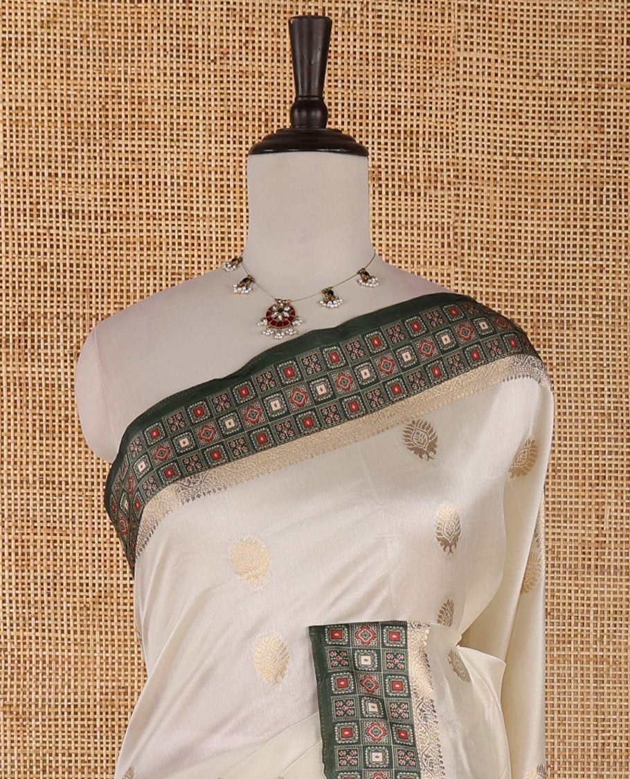 Cream gold zari buttas semi-organza saree, contrast zari & Ajrakh printed green border, zari weaving pallu & Ajrakh printed blouse