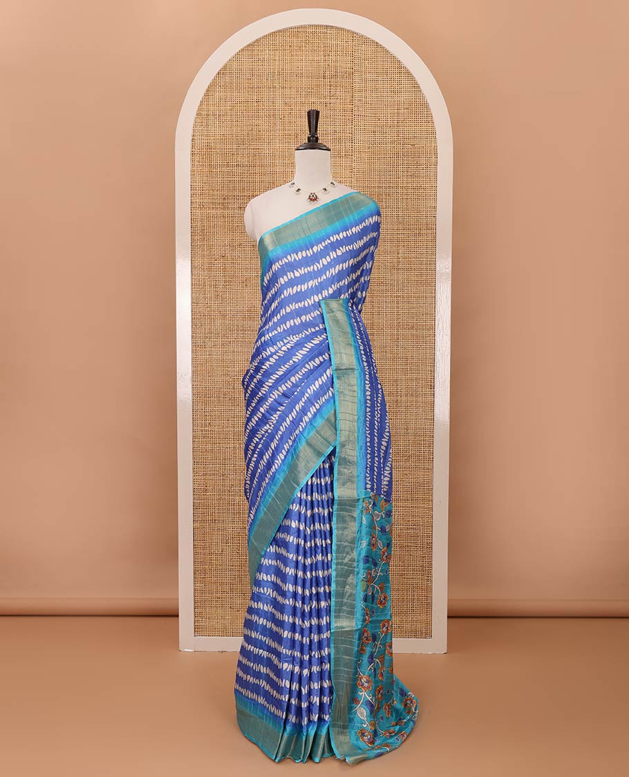 Blue uniquely printed soft tussar saree, contrast zari border, kalamkari floral vine printed pallu & kalamkari printed blouse