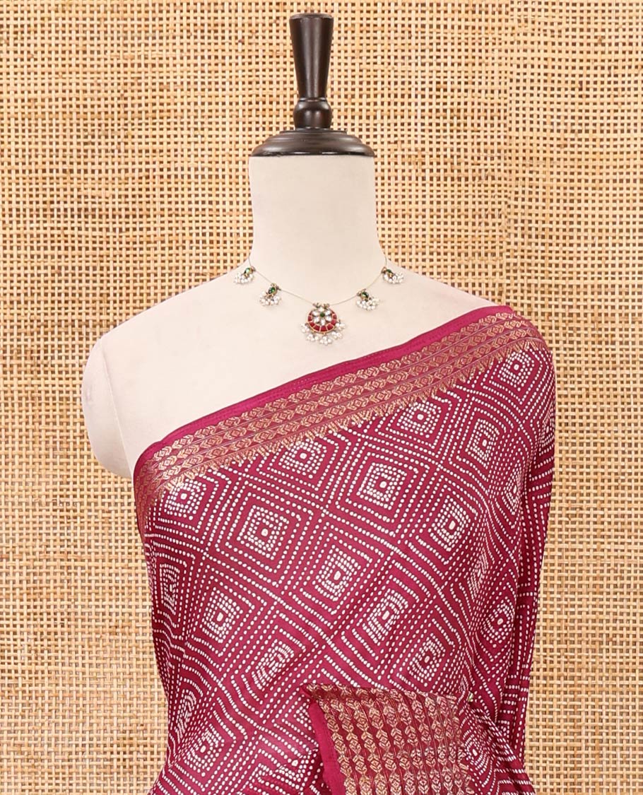 Maroon bandhani printed viscose moss chiffon saree, zari design border, floral-geometric printed pallu & diamond motif printed blouse
