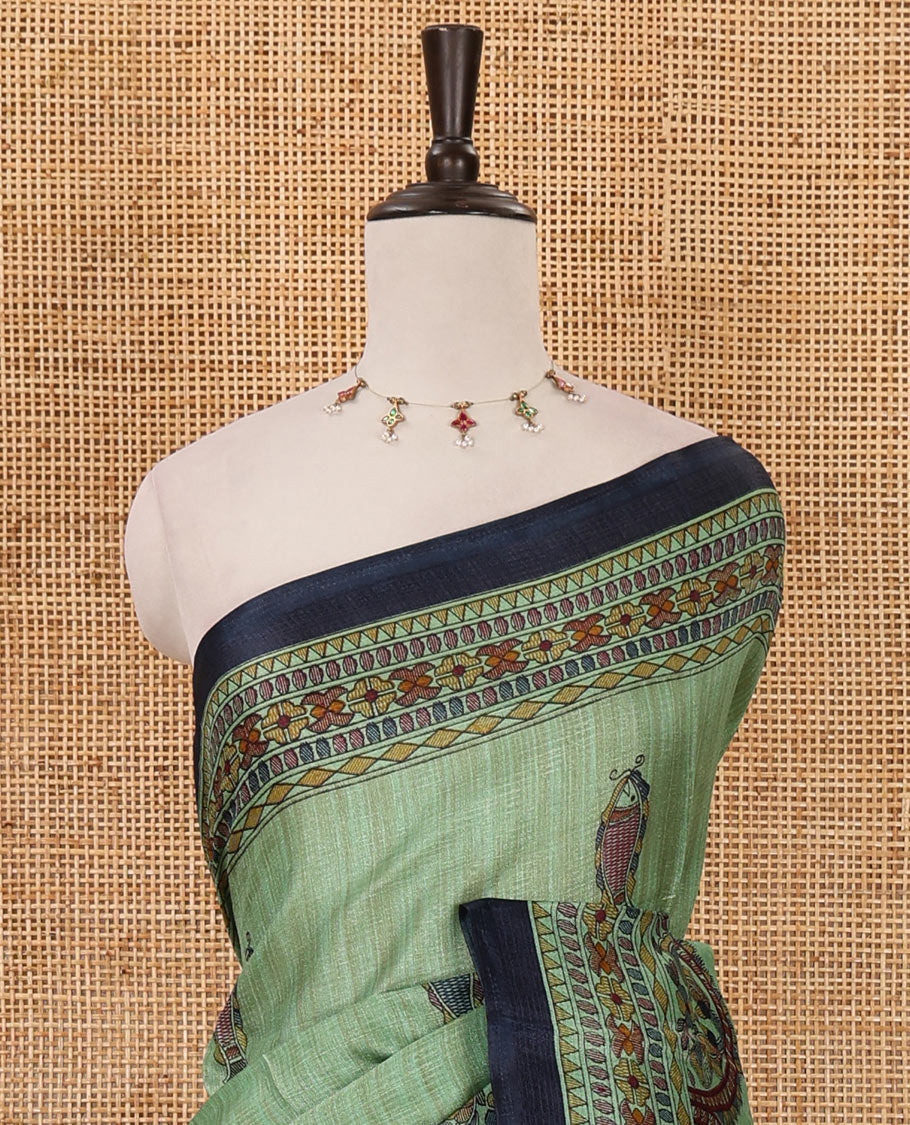 Green madhubani-style fish printed khadi cotton saree, floral printed border, madhubani printed pallu & contrast polka dots printed blouse