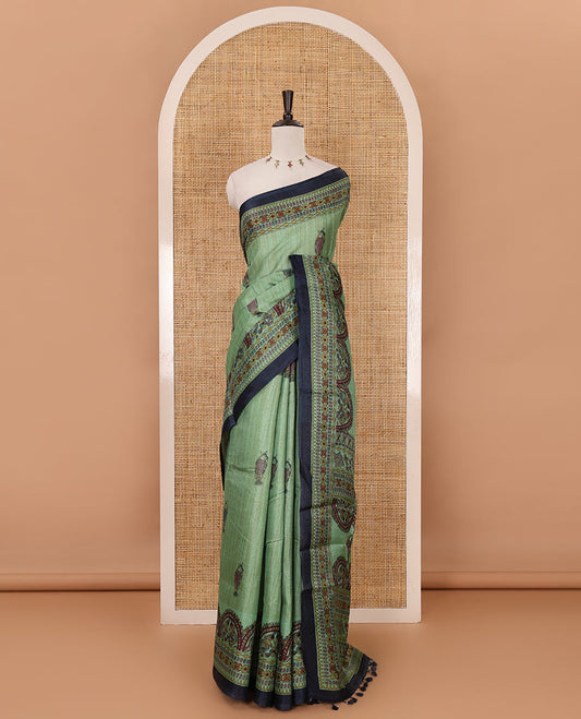 Green madhubani-style fish printed khadi cotton saree, floral printed border, madhubani printed pallu & contrast polka dots printed blouse