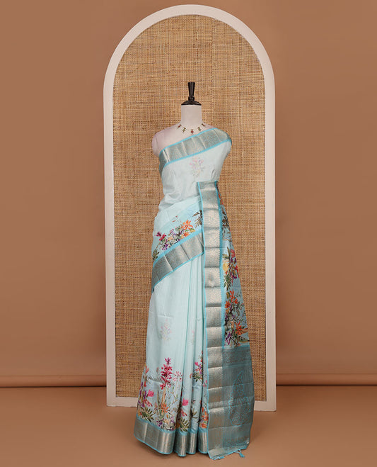 Sky blue tropical floral printed fancy tussar saree, contrast zari traditional design border, intricate Paisley motifs woven zari pallu, and printed blouse