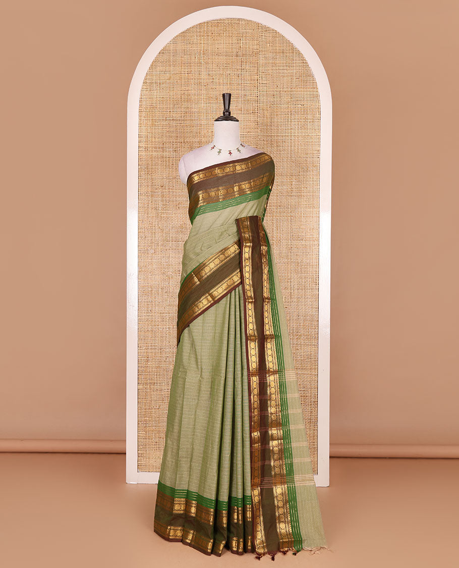 Green striped Chettinad cotton saree, contrast rettai rettu rudraksham motif zari border, striped pallu, and matching blouse