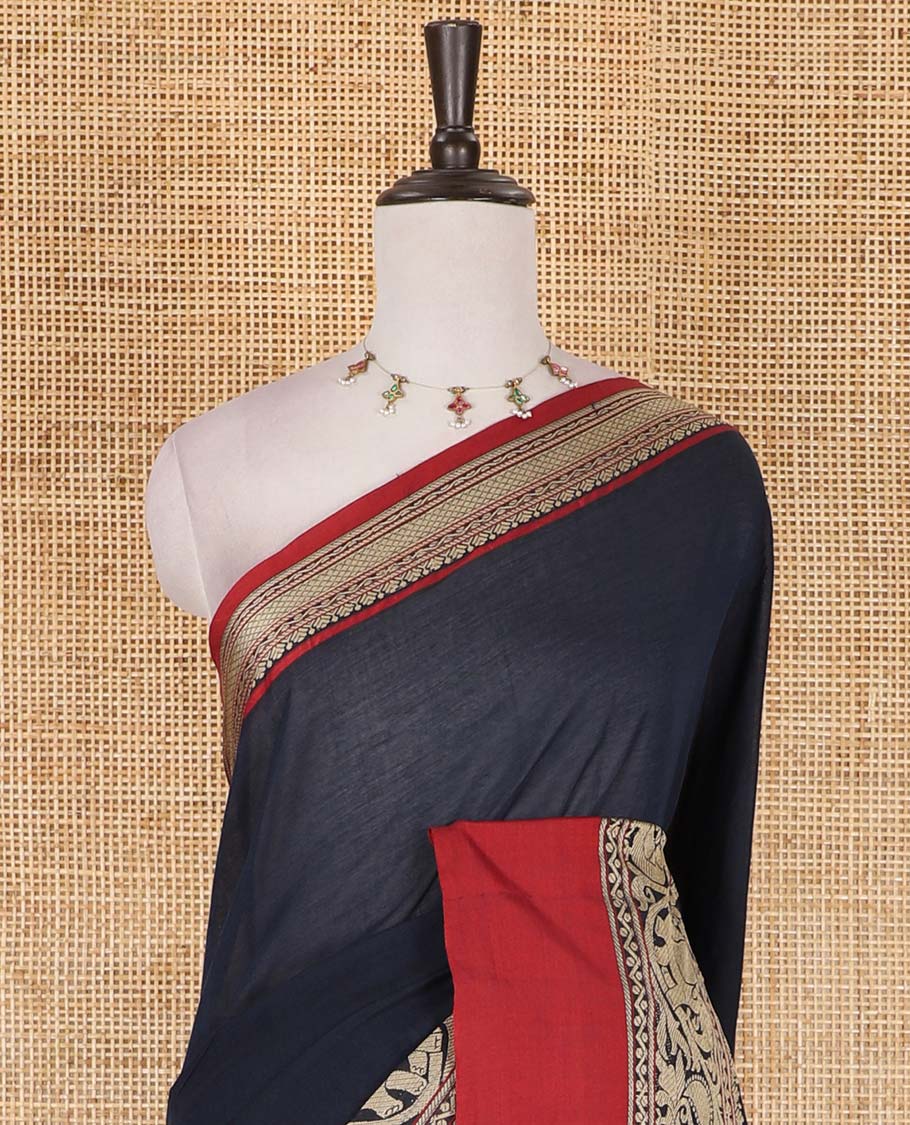 Navy blue plain mercerised cotton saree, contrast traditional border of peacock, and elephant motifs, striped pallu, and a matching blouse