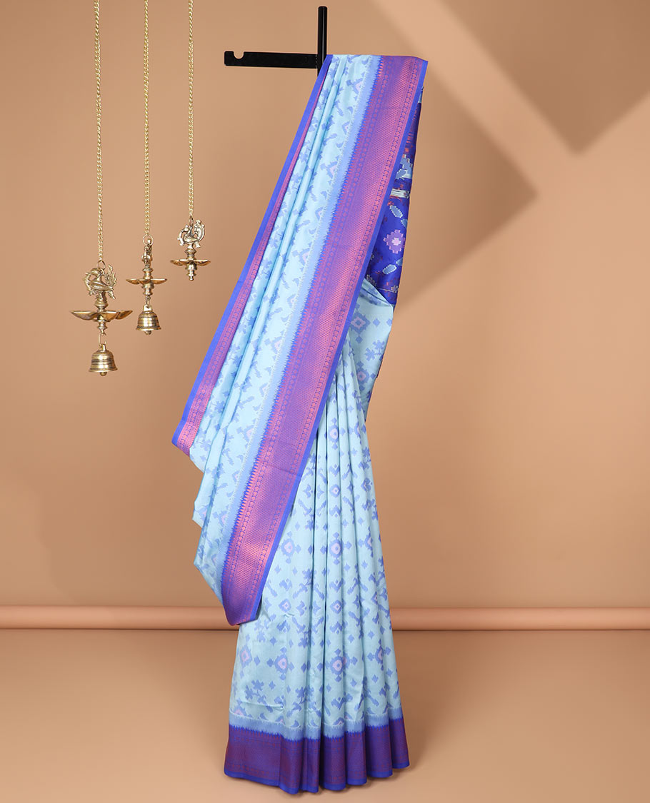 Sky blue ikkat design mulberry silk saree with contrast border & ikkat pallu along with self embosed butta blouse