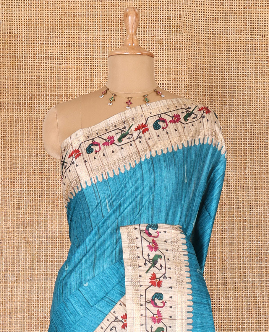 Blue muniya motifs katan silk saree, contrast paithani style border, pallu and blouse steeped with peacock, parrot, and floral motifs