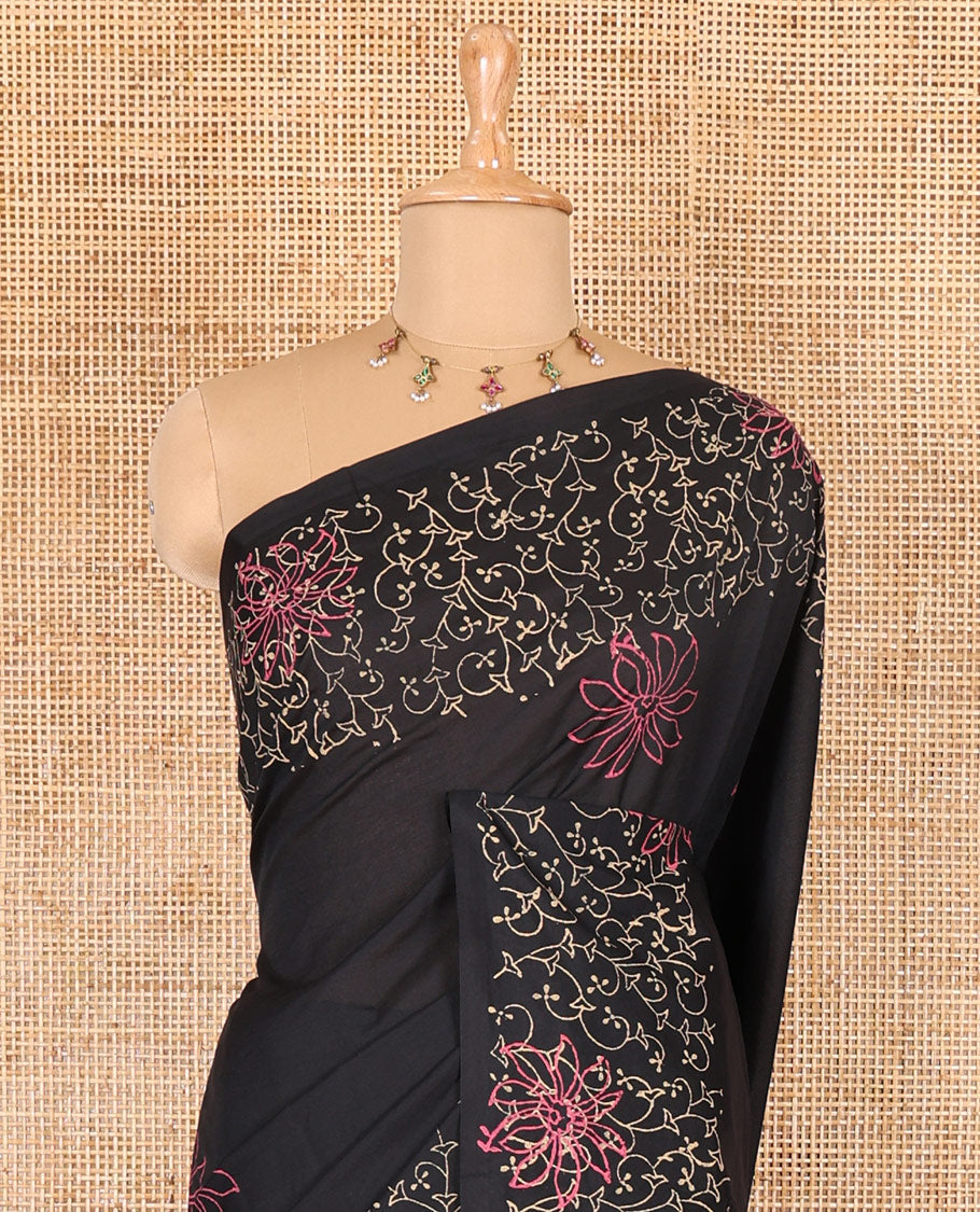 Black floral block printed South cotton saree, floral vine block printed border, floral printed pallu, and a matching blouse and a contrast floral motifs printed blouse
