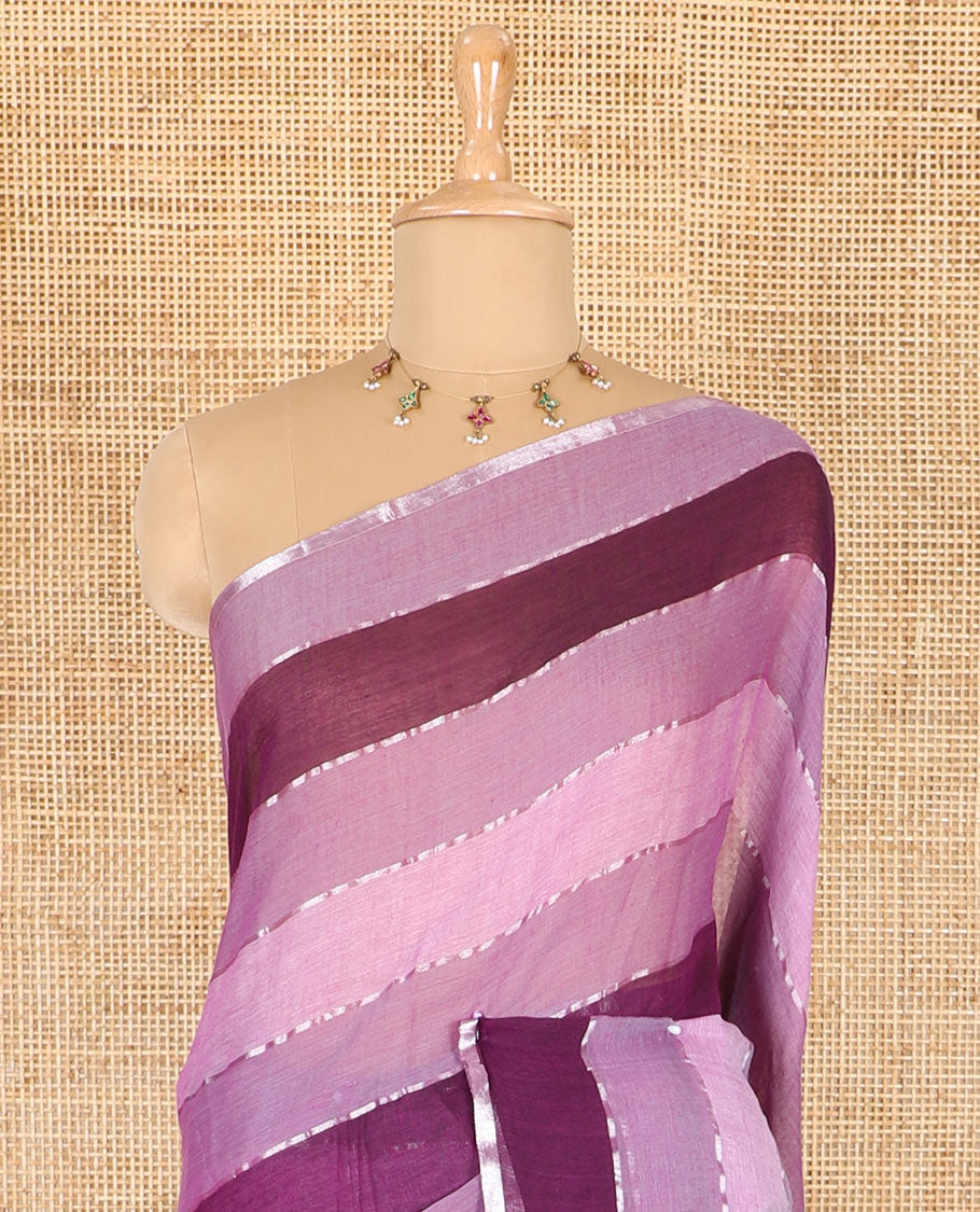 Magenta ombre-colored striped khadi mul cotton saree, zari piping border, striped pallu, and a matching striped blouse