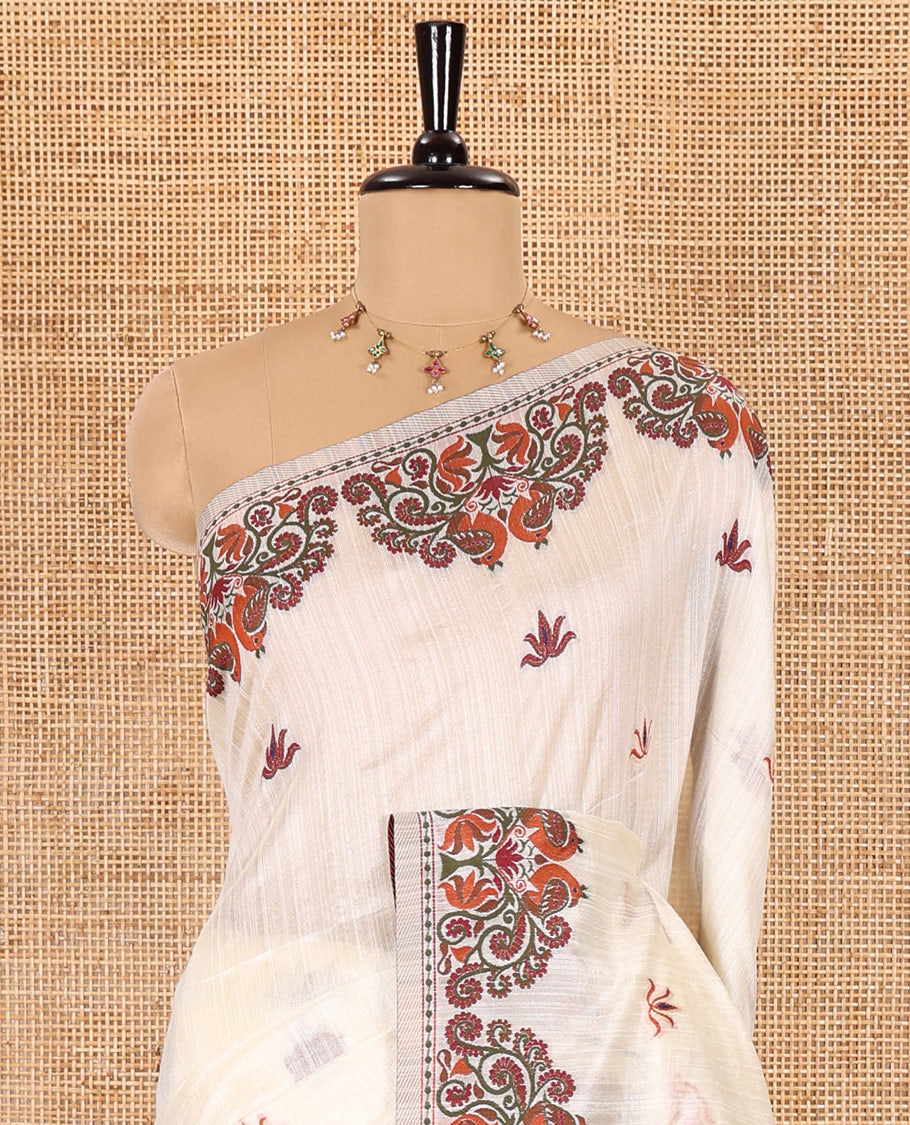 Half-white lotus motifs thread woven jute cotton, scallop thread woven border, pallu of lotus, peacock and paisley designs along with a plain blouse