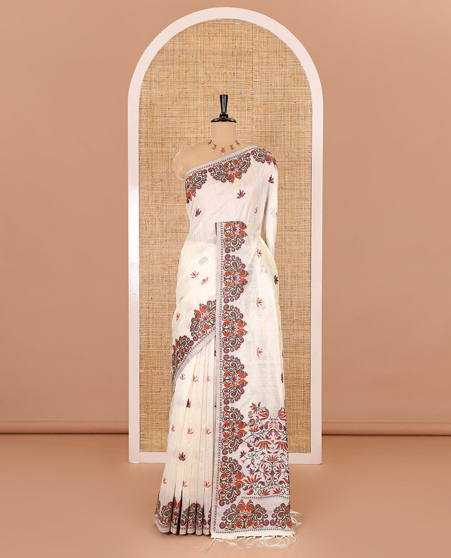 Half-white lotus motifs thread woven jute cotton, scallop thread woven border, pallu of lotus, peacock and paisley designs along with a plain blouse