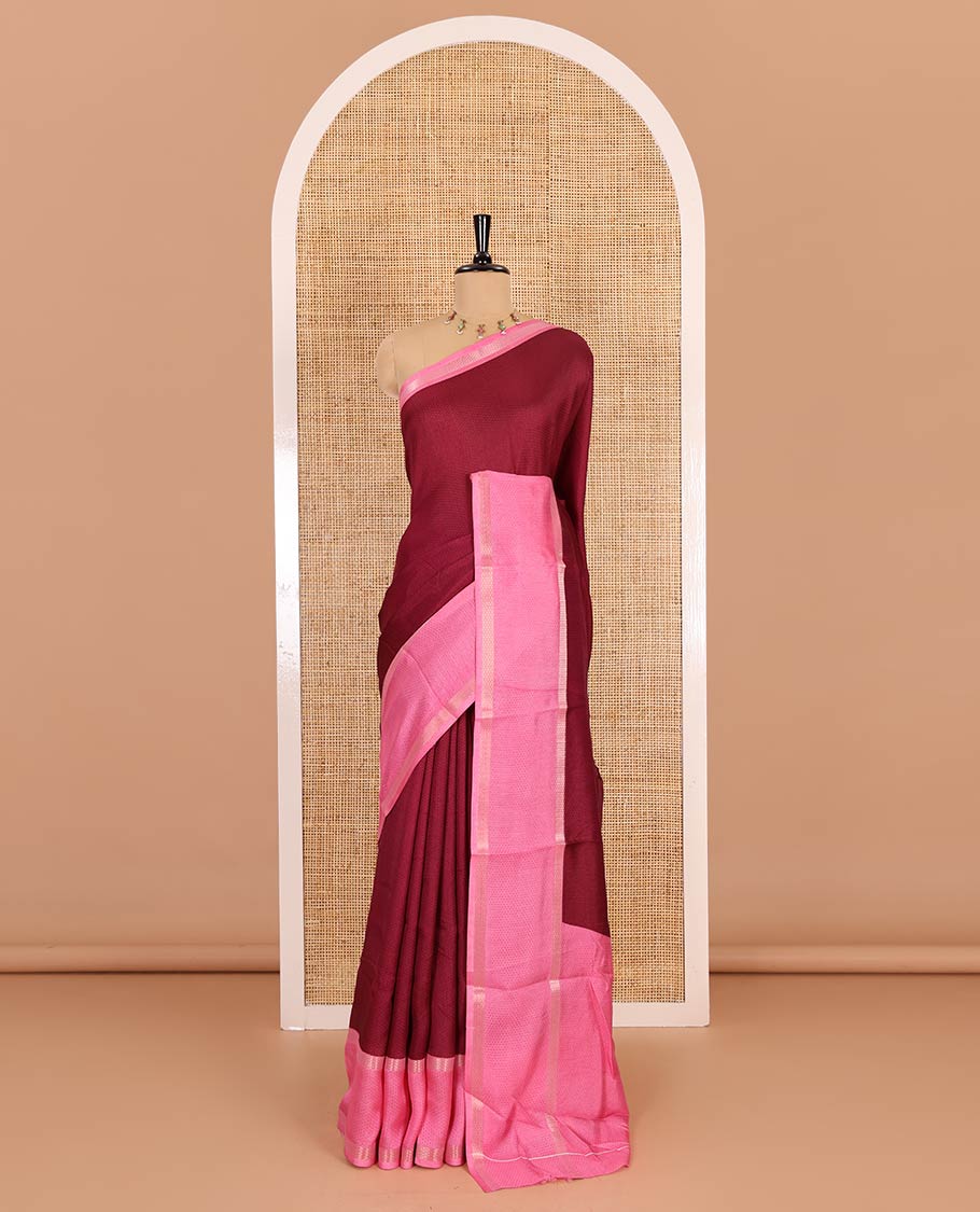 Wine embossed moss chiffon saree, contrast traditional rettai pettu border, embossed pallu, and a contrast embossed blouse