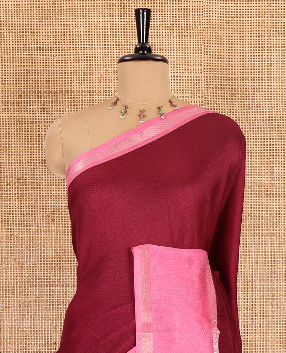 Wine embossed moss chiffon saree, contrast traditional rettai pettu border, embossed pallu, and a contrast embossed blouse