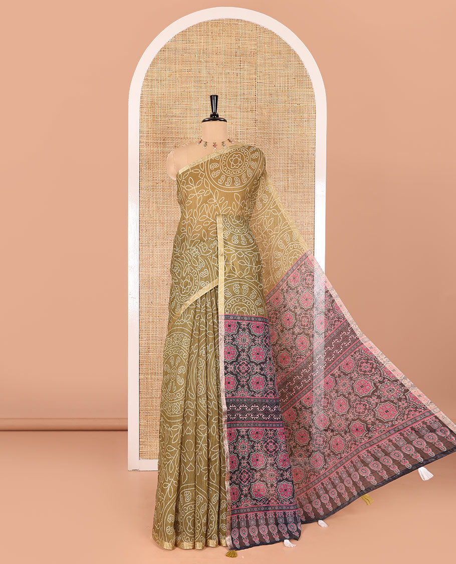 Green bandhani-style floral and chakra printed saree, zari piping border, contrast ajrakh printed pallu, and contrast ajrakh printed blouse