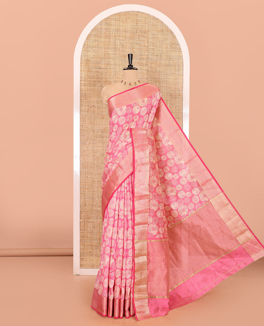Pink lotus-leaf style printed semi-tussar saree, traditional zari border, zari striped pallu, and a matching blouse